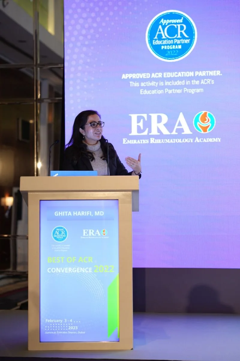 Dr Ghita Harifi giving a conference presentation.